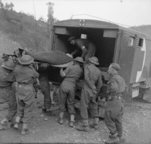 Patient being loaded in to ambulance in Italy