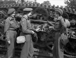 RCAMC nursing sisters examining the wreckage of a German tank Source: TBC